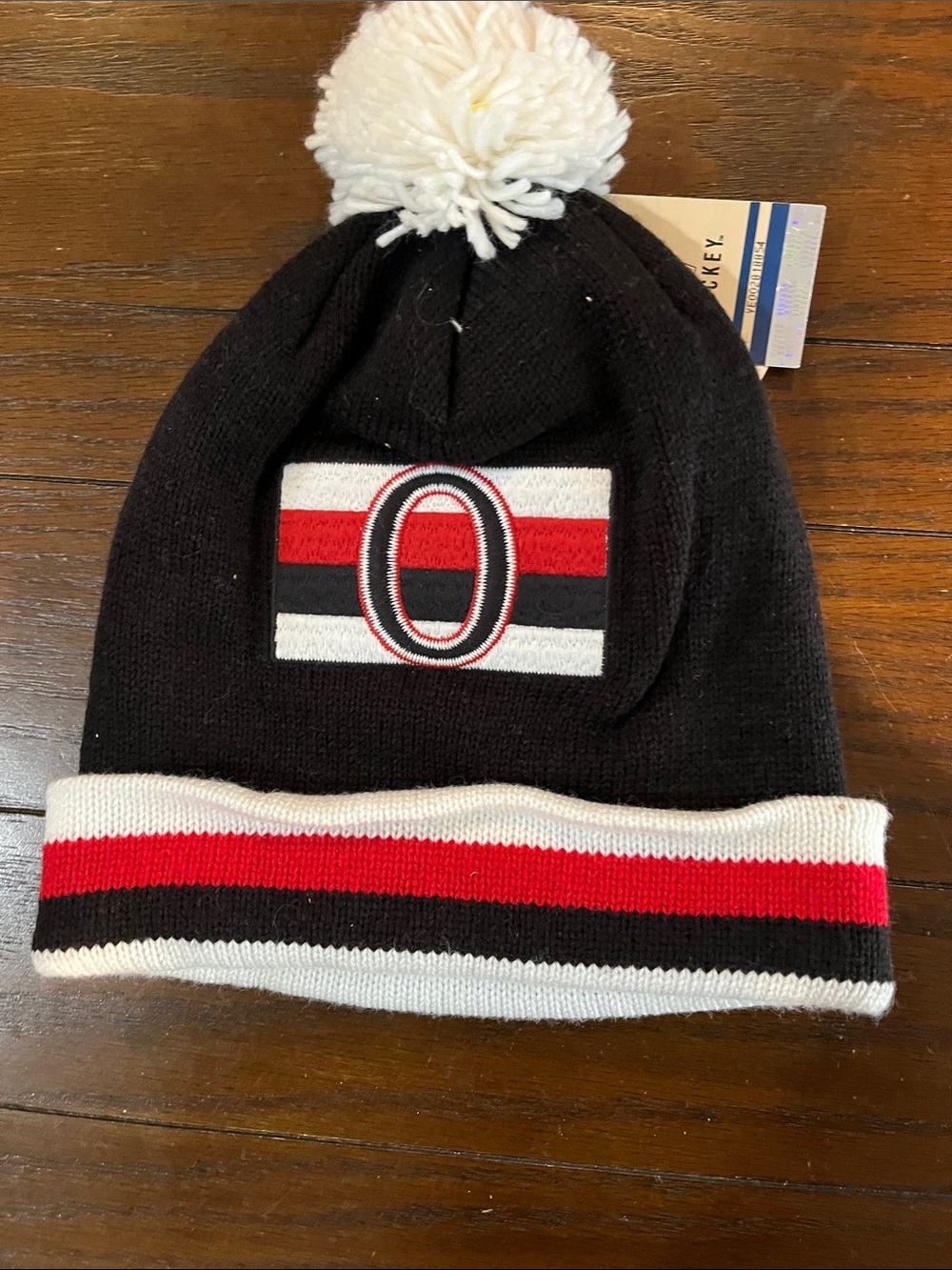 Mitchell & Ness Black Beanie with White Pom and Red Stripe